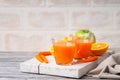 Glasses with carrot juice, apple and sliced orange Royalty Free Stock Photo