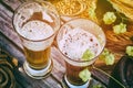 Fresh cold beer glasses in rustic setting Royalty Free Stock Photo