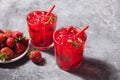 Glasses with fresh homemade strawberry sweet iced tea or cocktail, lemonade with mint. Refreshing cold drink. Summer party Royalty Free Stock Photo