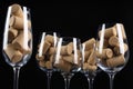 Glasses full of many wine corks on black background Royalty Free Stock Photo