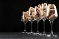 Glasses full of wine corks on black table. Space for text Royalty Free Stock Photo