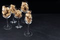 Glasses full of wine corks on black table. Space for text Royalty Free Stock Photo