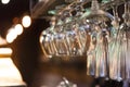 Glasses hanging on bar rack close up Royalty Free Stock Photo