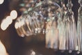 Glasses hanging on bar rack close up Royalty Free Stock Photo