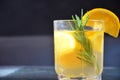 glasses of honey bourbon cocktail with rosemary whiskey sour drink with orange peel, or winter warmer drink punch or
