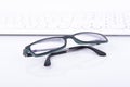 Glasses with keyboard Royalty Free Stock Photo