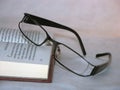 Glasses laying on a book Royalty Free Stock Photo