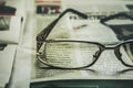 Glasses on a newspaper . News reading concept Royalty Free Stock Photo