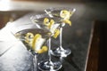 Glasses of lemon drop martini cocktail on bar counter, closeup. Royalty Free Stock Photo
