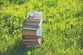 Glasses lie on a stack of books outdoors Royalty Free Stock Photo