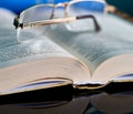 Glasses lie on a stack of books, science Royalty Free Stock Photo