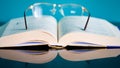 Glasses lie on a stack of books, science Royalty Free Stock Photo