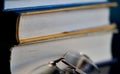 Glasses lie on a stack of books, science Royalty Free Stock Photo