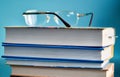 Glasses lie on a stack of books, science Royalty Free Stock Photo