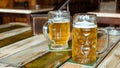 Glasses of light beer on pub background. Pint glass of golden beer with snacks Royalty Free Stock Photo