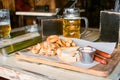 Glasses of light beer on pub background. Pint glass of golden beer with snacks Royalty Free Stock Photo