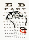 Glasses lying on optotype test Royalty Free Stock Photo