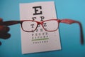 glasses lying on snellen test chart Royalty Free Stock Photo