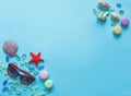 Glasses, macaroons box, transparent pebbles and a shell,starfish. Royalty Free Stock Photo
