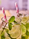 Glasses with mohito and straw.