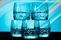 Glasses in the multicolored light of the club. Royalty Free Stock Photo