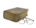 Glasses near very old bible Royalty Free Stock Photo