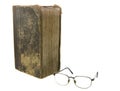 Glasses near very old bible Royalty Free Stock Photo