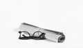 Glasses and news paper roll Royalty Free Stock Photo