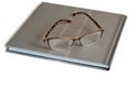 Glasses and notebook on a white background.