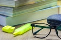 Glasses and old books stacked. Royalty Free Stock Photo