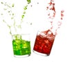 Glasses of olourful cold drinks with water splash and ice cubes. Royalty Free Stock Photo