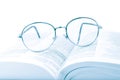 Glasses on the open book Royalty Free Stock Photo