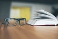 Glasses and open book Royalty Free Stock Photo