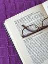 glasses on open book