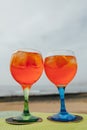 Glasses with orange alcohol spritz cocktail