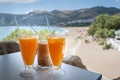 Glasses with orange juice and frappe on a table in the traditional greek tavern.