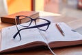 Glasses and a pen on a diary Royalty Free Stock Photo