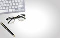 Glasses, pen, laptop - office tools on light gray background. Illustration. View from top Royalty Free Stock Photo