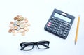 Top view a glasses,pencil, money, calculator and chart or graph on office desk table.Finance and business concept. Royalty Free Stock Photo
