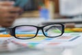 The glasses placed on the desk are pre-made glasses for working in order to increase the field of view for designers who need work