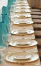 Glasses and plates in a row Royalty Free Stock Photo