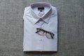 Glasses put on purple folded mens shirt