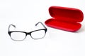 Glasses and red case on a white background Royalty Free Stock Photo