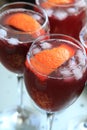 glasses of red sangria with grapefruit slices on the table close-up view