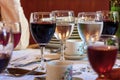 Glasses with red and white wine and coffee cups close-up. Served table in the restaurant Royalty Free Stock Photo