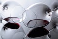 Glasses of red wine on a black reflective background Royalty Free Stock Photo