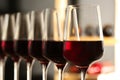 Glasses of red wine in cellar. Expensive drink Royalty Free Stock Photo