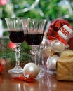 Glasses of red wine in front of Christmas tree