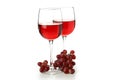 Glasses of red wine and grape isolated on white background Royalty Free Stock Photo