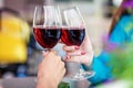 Glasses of red wine in their hands. Toast. The concept of party Royalty Free Stock Photo